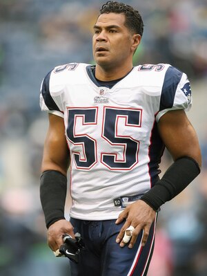 Junior Seau, seen here playing for the New England Patriots toward the end of his career, suffered from a degenerative brain disease, scientists say.