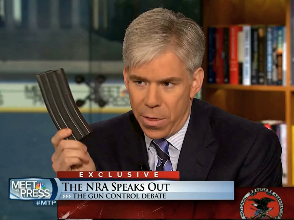 Meet the Press host David Gregory holds what he described as a high-capacity ammunition magazine during the Dec. 23 program.