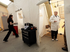 Registered nurse Michelle Newbury and physician assistant Scott Fillman see patients Thursday in a tent set up for people with flu symptoms, just outside the emergency entrance at the Lehigh Valley Hospital in Allentown, Pa. Registered nurse Michelle Newbury and physician assistant Scott Fillman see patients Thursday in a tent set up for people with flu symptoms, just outside the emergency entrance at the Lehigh Valley Hospital in Allentown, Pa.