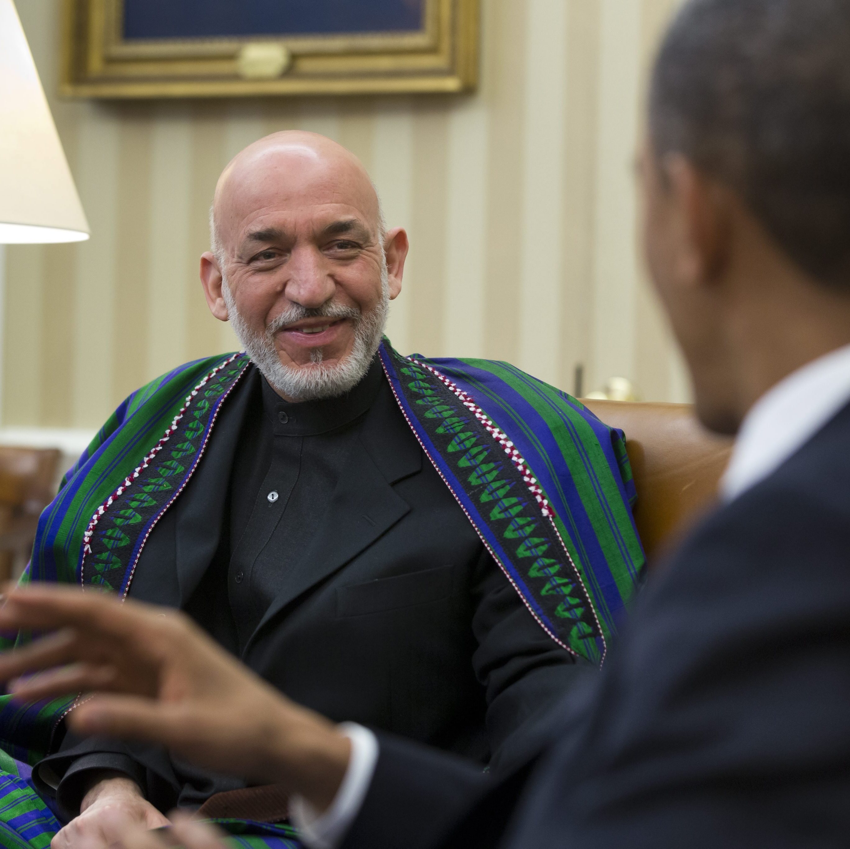 Afghan President Hamid Karzai smiled as President Obama gestured earlier today in the Oval Office.