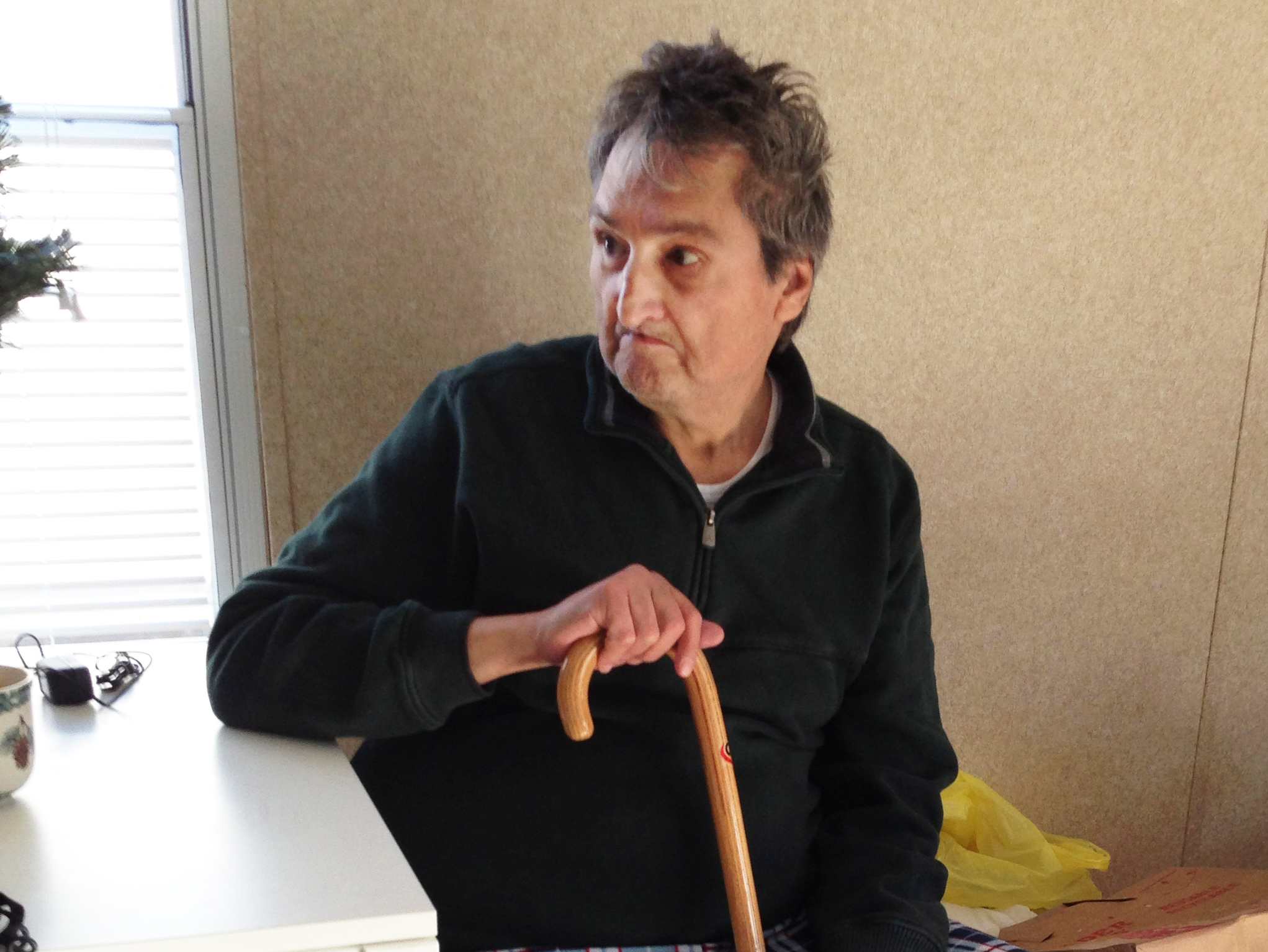 Robert Rassi, 67, in his family's kitchen. After losing everything when their Staten Island home flooded during Sandy, they can live here rent-free for one year.