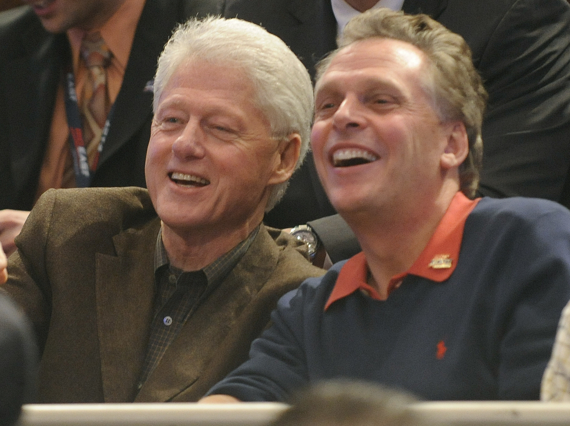 Former Democratic National Committee chairman Terry McAulliffe watches the Big East basketball tournament with former President Bill Clinton on March 11, 2010, in New York.