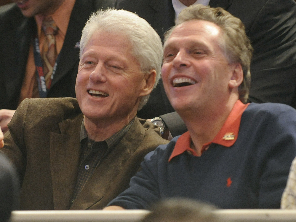 Former Democratic National Committee chairman Terry McAulliffe watches the Big East basketball tournament with former President Bill Clinton on March 11, 2010, in New York. Former Democratic National Committee chairman Terry McAulliffe watches the Big East basketball tournament with former President Bill Clinton on March 11, 2010, in New York.