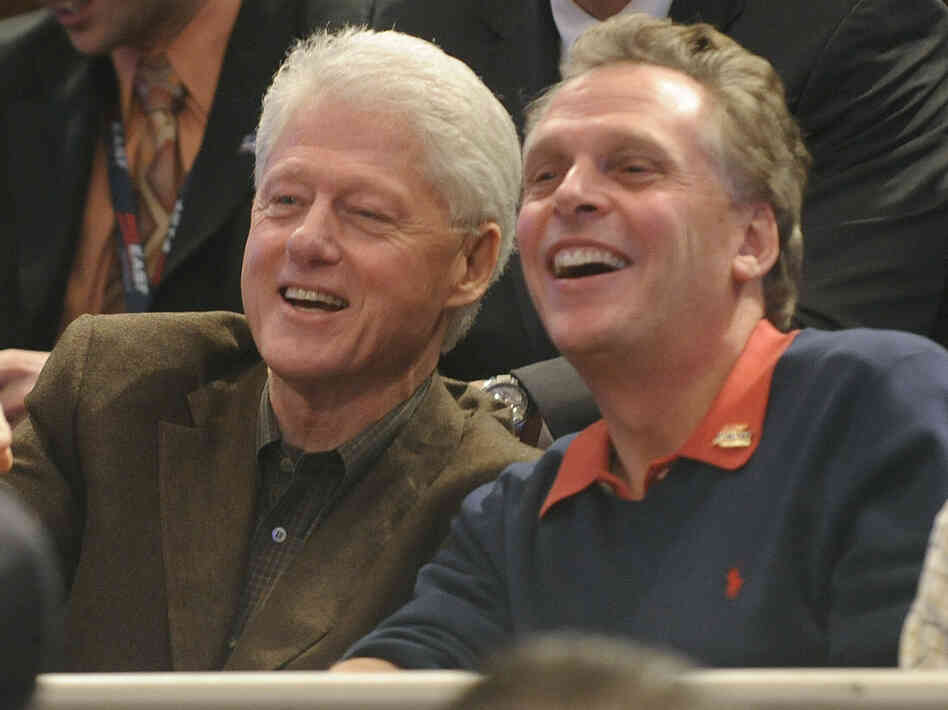 Former Democratic National Committee chairman Terry McAulliffe watches the Big East basketball tournament with former President Bill Clinton on March 11, 2010, in New York.