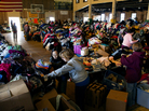 Thousands of food and clothing items are organized by Occupy Sandy volunteers in a school gymnasium in Rockaway Park, Queens, after Superstorm Sandy in November. Thousands of food and clothing items are organized by Occupy Sandy volunteers in a school gymnasium in Rockaway Park, Queens, after Superstorm Sandy in November.