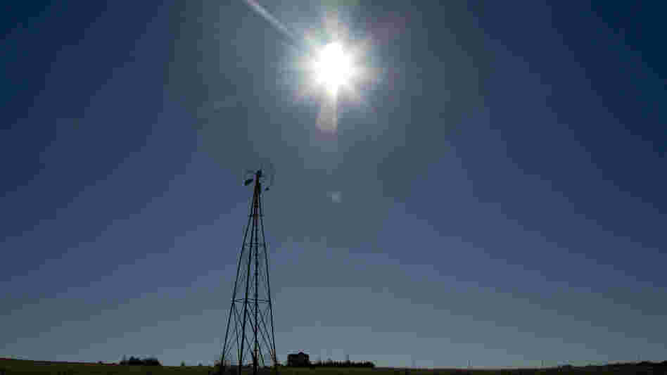 The sun shines above a farm near White City, Kan., in November.