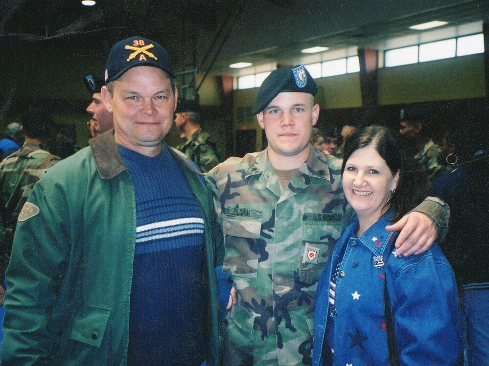 Lance Pilgrim with his parents, Randy and Judy, at the pre-deployment ceremony at Fort Sill, Okla., in January 2003.