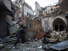 A rebel fighter fires toward Syrian government forces in the Bab al-Nasr district of Aleppo's Old City, earlier this month. The city has been a major battleground for the past six months. A rebel fighter fires toward Syrian government forces in the Bab al-Nasr district of Aleppo's Old City, earlier this month. The city has been a major battleground for the past six months.