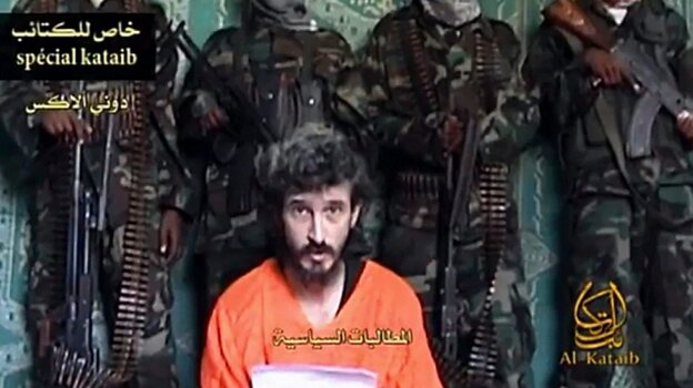 An undated screen image of footage shot by Al-Kataib Media, showing Denis Allex, a French hostage allegedly held by Somali militants, who was reportedly killed during the  failed rescue mission.