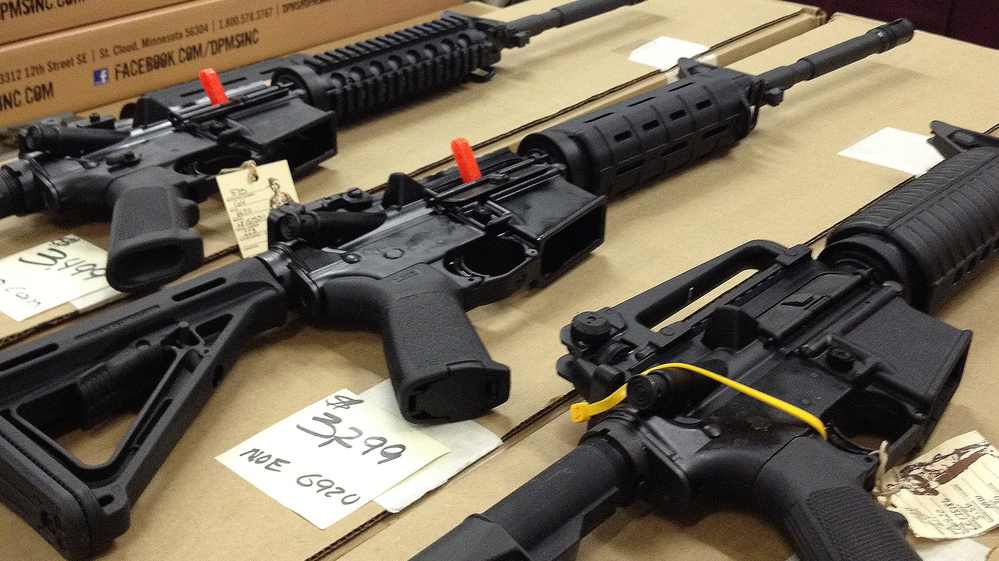 Rifles are displayed at a gun show in Marietta, Ga., on Dec. 22, 2012. A new poll shows overwhelming and bipartisan support for requiring criminal background checks before the sale of firearms at gun shows, as is already required before store sales.