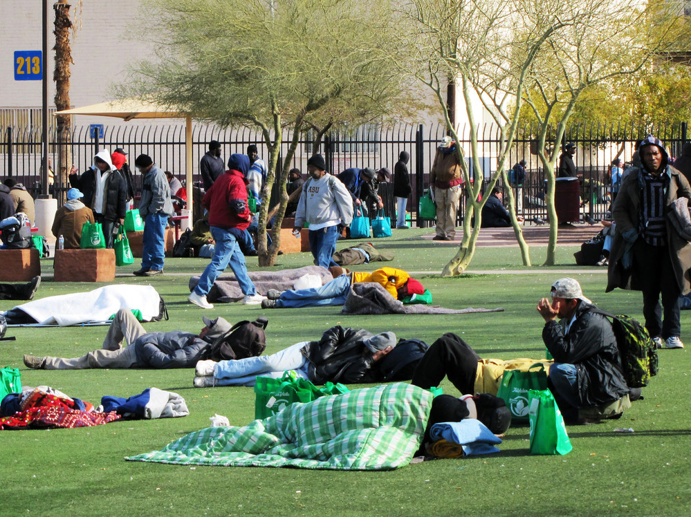 The homeless battle freezing temperatures outside Central Arizona Shelter Services near downtown Phoenix.
