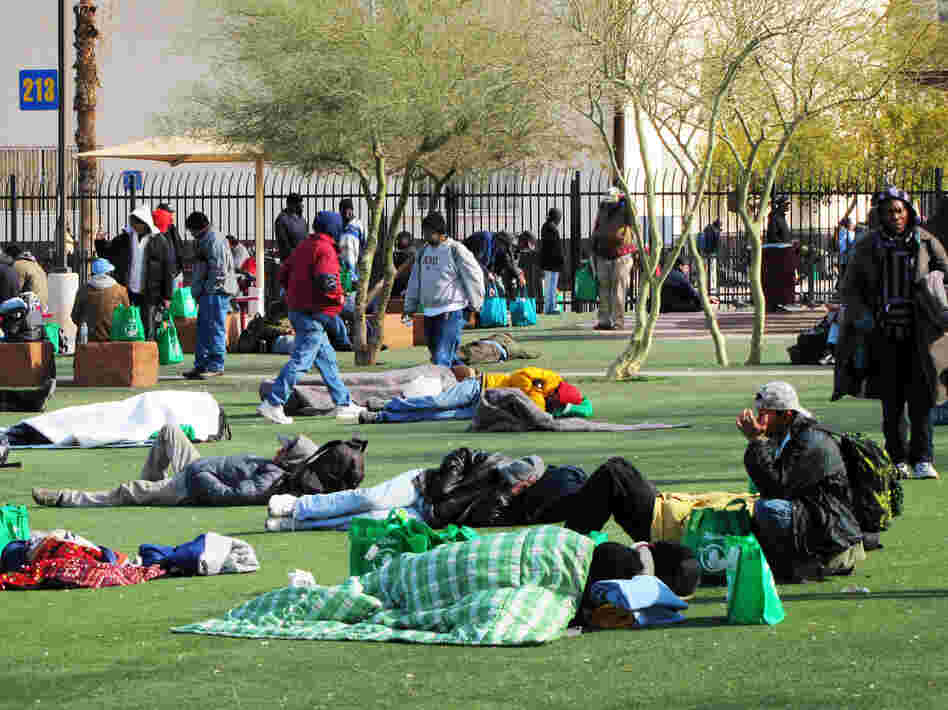 The homeless battle freezing temperatures outside Central Arizona Shelter Services near downtown Phoenix.