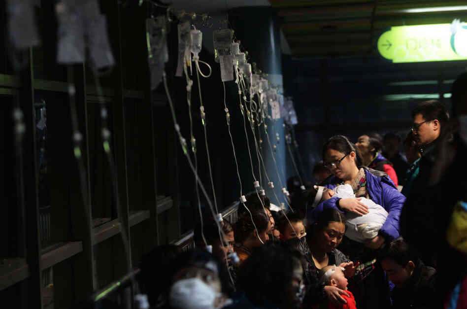 Beijing hospitals saw a spike in respiratory cases Monday following a weekend of off-the-charts pollution. Here, a row of intravenous drips is seen as parents take their kids to hospital for flu treatment Sunday. 