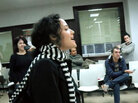 A woman sings "Here Comes the Sun" by the Beatles in an unemployment office in Spain as part of a flash mob organized to cheer up those waiting in the office to find work. A woman sings "Here Comes the Sun" by the Beatles in an unemployment office in Spain as part of a flash mob organized to cheer up those waiting in the office to find work.