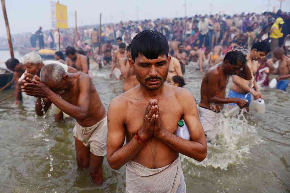 Hindu devotees pray at the Sangam, or confluence, of the Yamuna and Ganges rivers during the Kumbh Mela festival in Allahabad, India, on Monday.