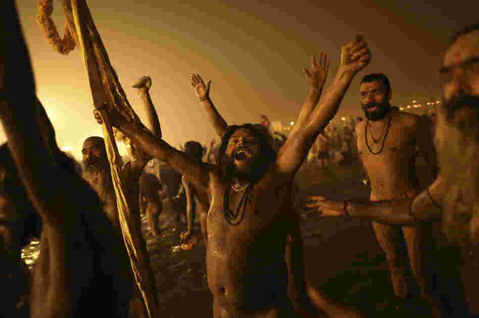 Naga Sadhus celebrate naked in the water at Sangam.