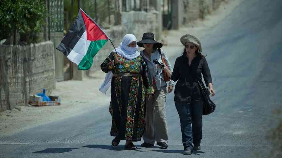NPR correspondent Lourdes Garcia-Navarro (right) conducts an interview in the West Bank.