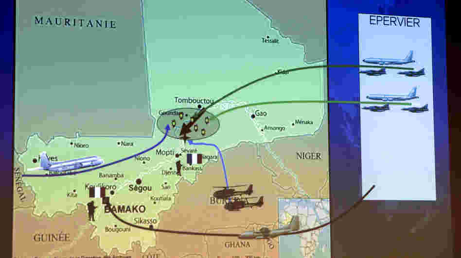 A map shown Sunday during a news conference held by French Defense Minister Jean-Yves Le Drian in Paris shows the movement of French troops and aircraft n Mali.