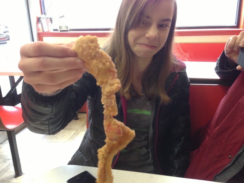 Robert's daughter Talia inspects the merchandise.