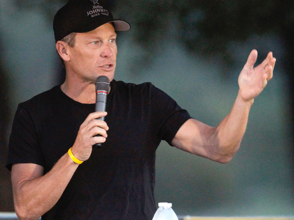 Cyclist Lance Armstrong addresses participants at a Livestrong event in October.