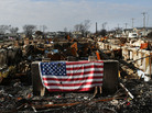 A U.S. flag still hung on the remains of homes in the Breezy Point neighborhood of Queens, N.Y., in December, nearly two months after Superstorm Sandy tore through the area. A U.S. flag still hung on the remains of homes in the Breezy Point neighborhood of Queens, N.Y., in December, nearly two months after Superstorm Sandy tore through the area.