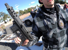 A police officer holds an assault weapon turned in during a gun buyback in the Van Nuys area of north Los Angeles on Dec. 26. A police officer holds an assault weapon turned in during a gun buyback in the Van Nuys area of north Los Angeles on Dec. 26.
