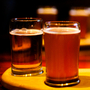 Beers on a table at a bar.