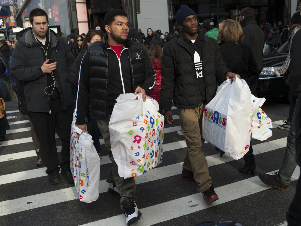 Shoppers in Manhattan on Christmas Eve last month.