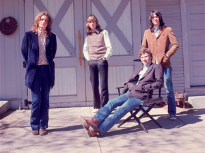 Big Star's members pose in front of their barn.