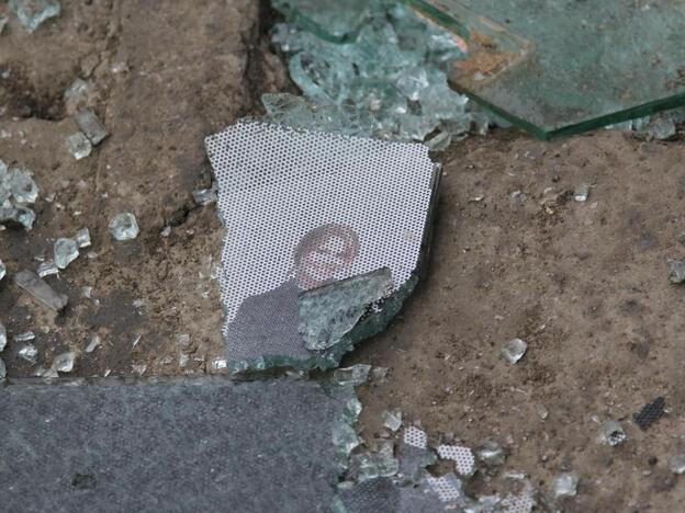 Glass, and remnants of a picture, on the street at the scene of the bombing in Kabul.