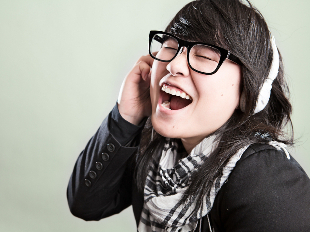 A woman listening to music.