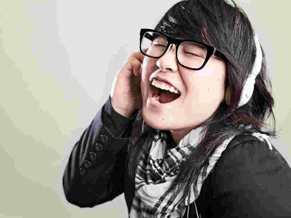 A woman listening to music.