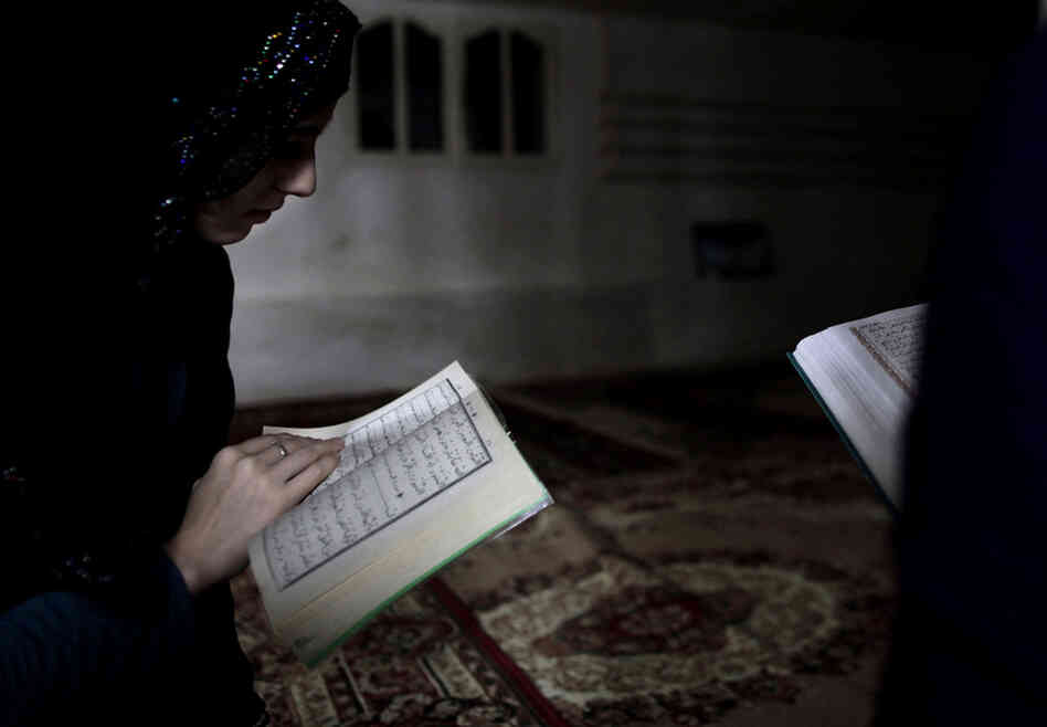 Chechen girls study the Quran at an underground madrassa in the Chechen village of Serzhen-Yurt. The new generation of youth are embracing Islam after decades of religious repression by secular Communist authorities in the Soviet Union.