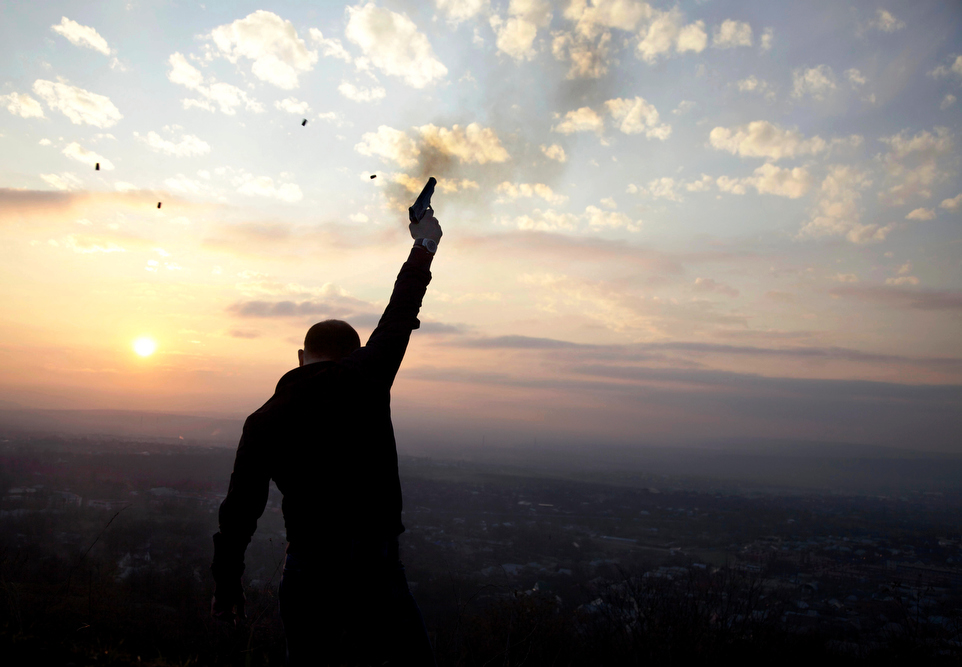 At sunset in the outskirts of Grozny, Kazbek Mutsaev, 29, fires celebratory gunshots as part of an age-old wedding tradition in Chechnya.