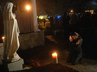 Aline Marie prays outside St. Rose of Lima church in Newtown, Conn., on the day of the school shooting. She says being photographed made her feel "like a zoo animal." The photographer says he tried hard to respect her privacy and grief. Aline Marie prays outside St. Rose of Lima church in Newtown, Conn., on the day of the school shooting. She says being photographed made her feel "like a zoo animal." The photographer says he tried hard to respect her privacy and grief.