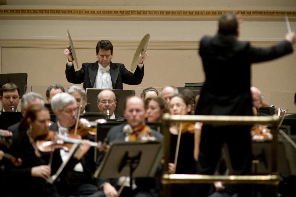 Philly principal percussionist Christopher Deviney poised for the big crash near the chaotic conclusion of Ravel's <em>La Valse</em>.
