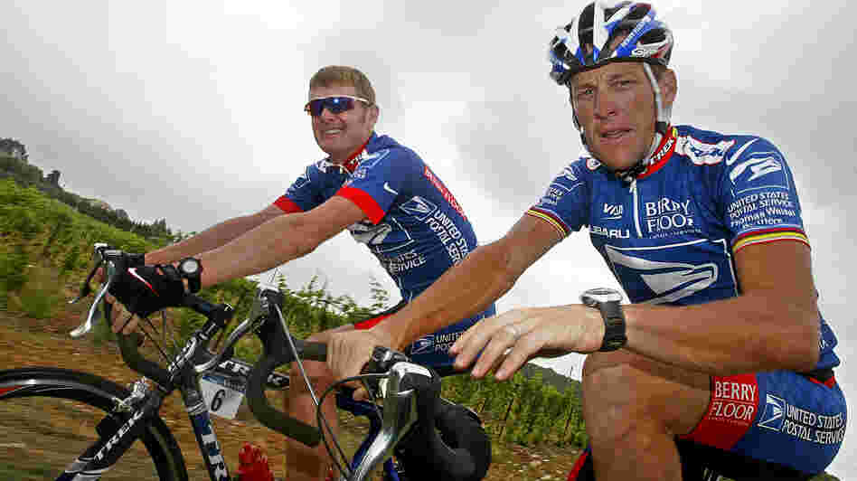 Lance Armstrong, right, faces several court cases tied to evidence that he cheated. One of the suits was filed by his former U.S. Postal Service teammate Floyd Landis. Here, the pair ride during the 2003 Tour de France.