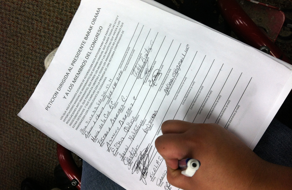 A supporter of an overhaul of immigration laws signs a petition to President Obama and Congress in Charlotte, N.C. A supporter of an overhaul of immigration laws signs a petition to President Obama and Congress in Charlotte, N.C.