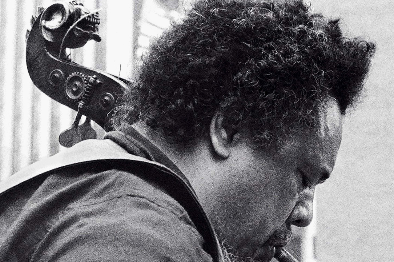 Charles Mingus in 1976, pictured with his lion's head bass, which is now played by the Mingus Orchestra's Boris Kozlov.