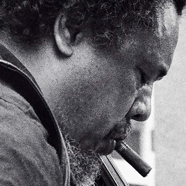 Charles Mingus in 1976, pictured with his lion's head bass, which is now played by the Mingus Orchestra's Boris Kozlov.