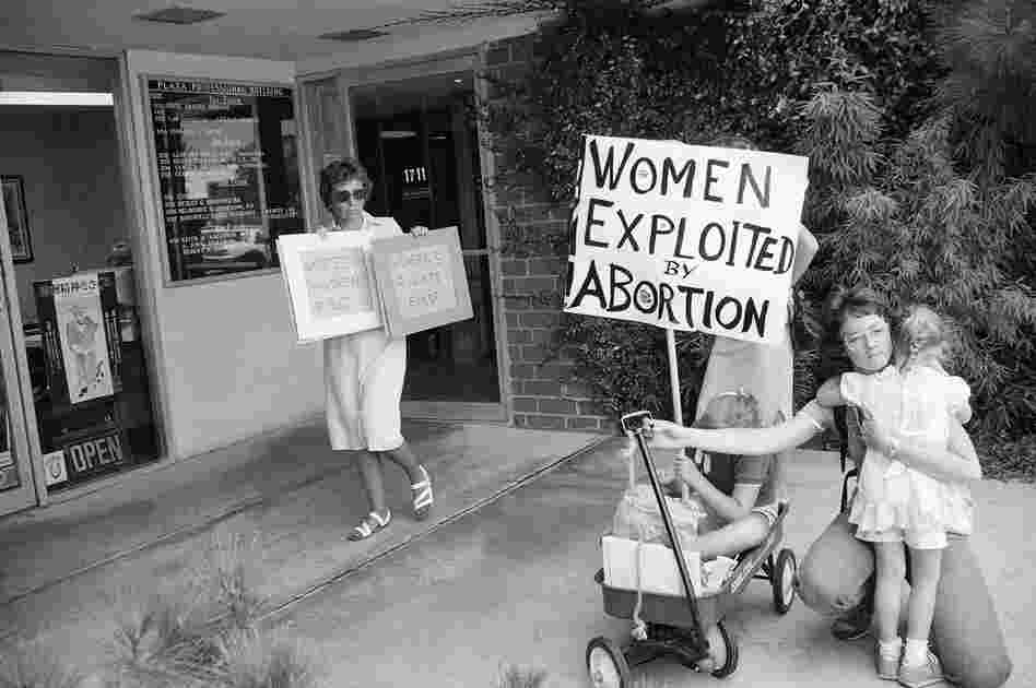 As time progressed, it became common to see anti-abortion protesters in front of abortion clinics, such as this scene in Torrance, Calif., on Aug. 27, 1985. Dr. Lynn Negus, of the University Of Southern California School Of Medicine, holds abortion-rights signs in counter to Debbie Thyfault and her children, who were part of an anti-abortion group.