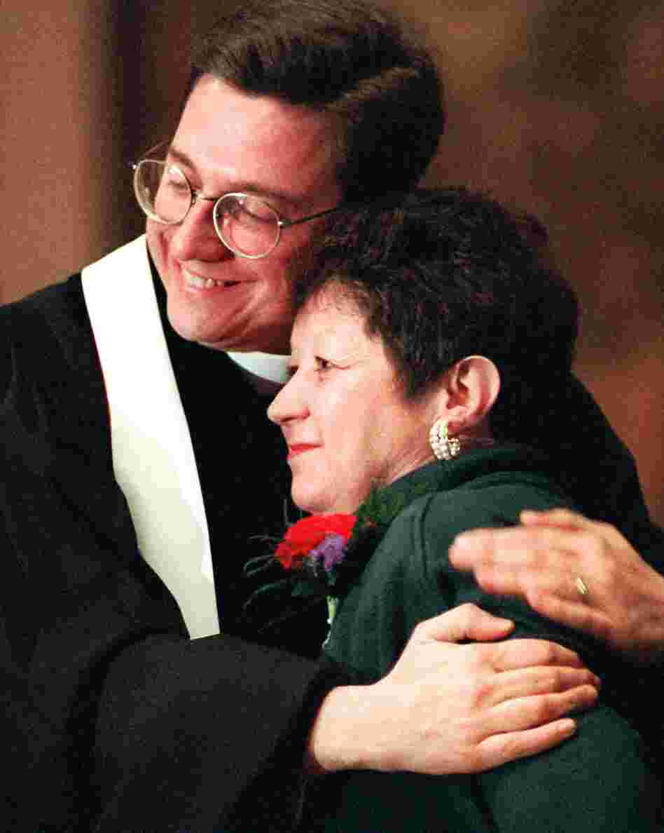 Norma McCorvey, the "Jane Roe" of the 1973 decision, embraces the Rev. Robert L. Schenck of the National Clergy Council before she addresses a memorial service at Georgetown University in Washington, D.C., on Jan. 21, 1996. A year earlier McCorvey shocked abortion-rights advocates by becoming a spokeswoman for the other side of the debate, stating she no longer supported abortion rights.