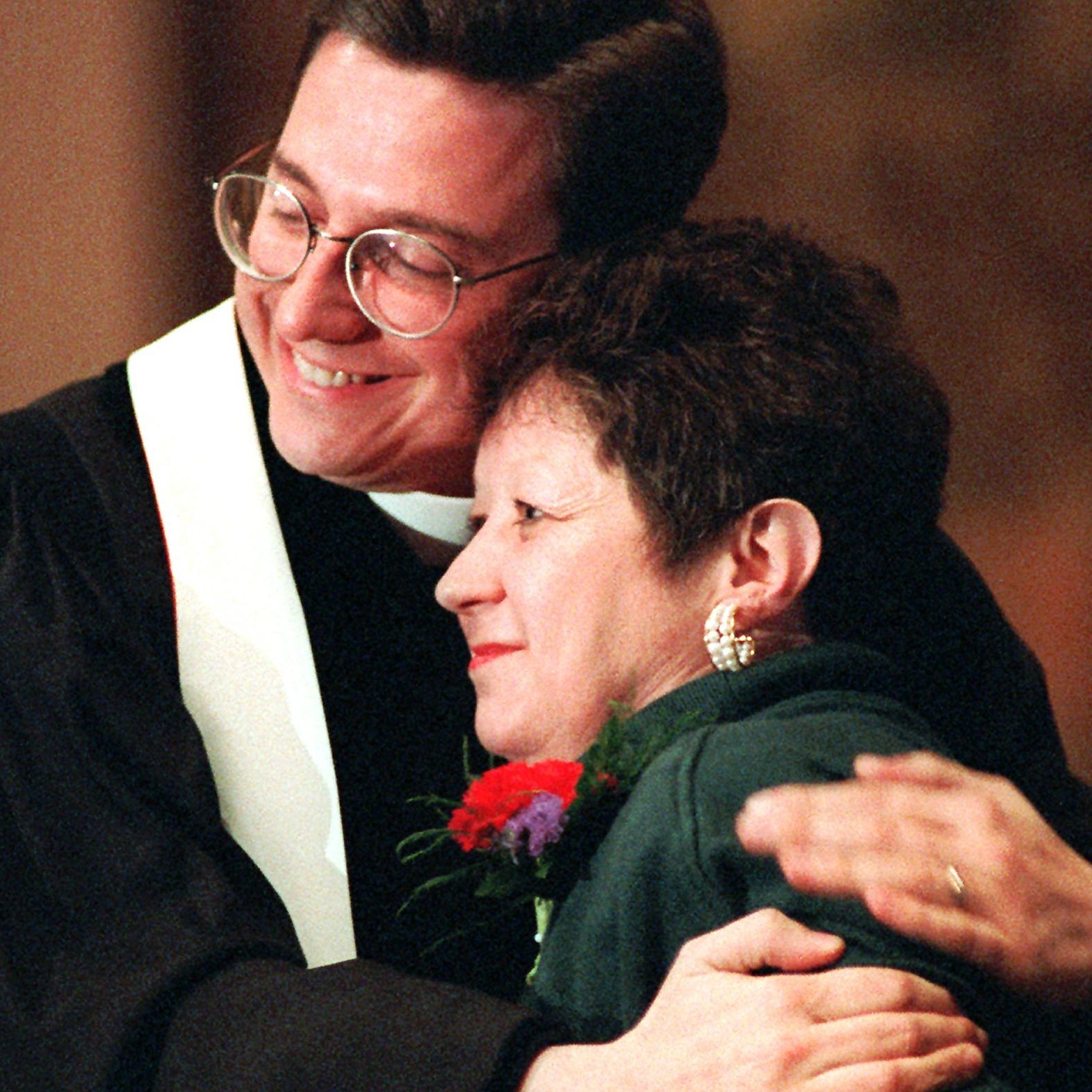 Norma McCorvey, the "Jane Roe" of the 1973 decision, embraces the Rev. Robert L. Schenck of the National Clergy Council before she addresses a memorial service at Georgetown University in Washington, D.C., on Jan. 21, 1996. A year earlier McCorvey shocked abortion-rights advocates by becoming a spokeswoman for the other side of the debate, stating she no longer supported abortion rights.