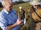 British farmer and businessman David Cundall (left) leads an archaeological excavation team searching for buried World War II Spitfires at an airport in Yangon, Myanmar, Jan. 7. He holds a miniature model of the fighter plane and is accompanied by Tracy Spaight, director of special projects at video game company Wargaming.net, who is funding the effort. British farmer and businessman David Cundall (left) leads an archaeological excavation team searching for buried World War II Spitfires at an airport in Yangon, Myanmar, Jan. 7. He holds a miniature model of the fighter plane and is accompanied by Tracy Spaight, director of special projects at video game company Wargaming.net, who is funding the effort.