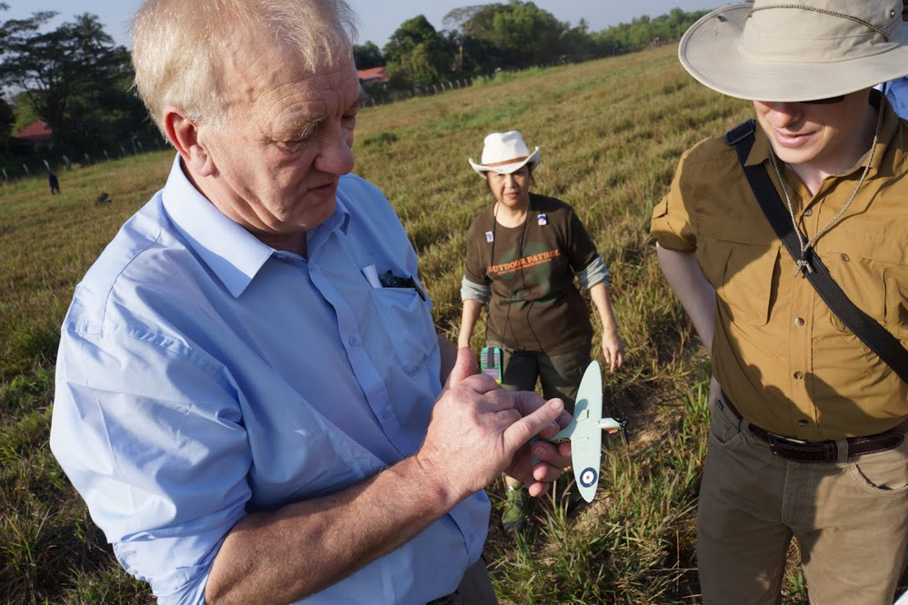 British farmer and businessman David Cundall (left) leads an archaeological excavation team searching for buried World War II Spitfires at an airport in Yangon, Myanmar, Jan. 7. He holds a miniature model of the fighter plane and is accompanied by Tracy Spaight, director of special projects at video game company Wargaming.net, who is funding the effort.