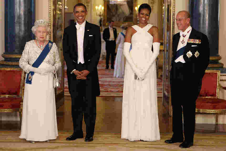 Diplomacy with style: The Obamas pose with Queen Elizabeth II and Prince Philip at Buckingham Palace ahead of a state banquet on May 24, 2011. Michelle's gown was designed by American fashion designer Tom Ford.
