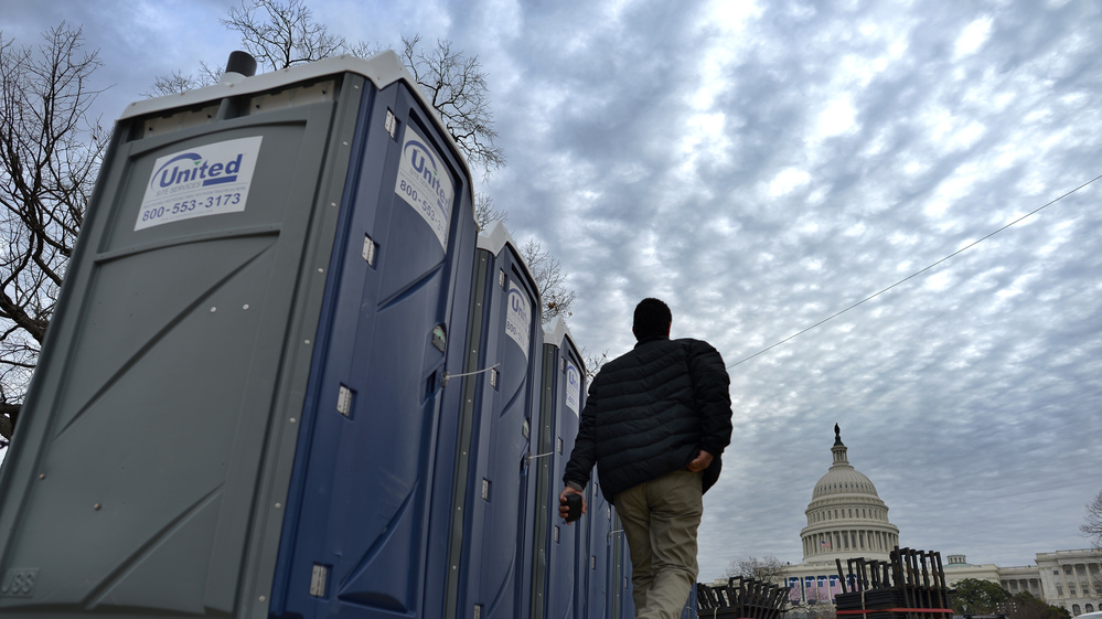 Portable toilets are installed around the U.S. Capitol in preparation for Monday's inauguration. A new app this year will help the crowd follow the event — and even find the closest port-a-potty.