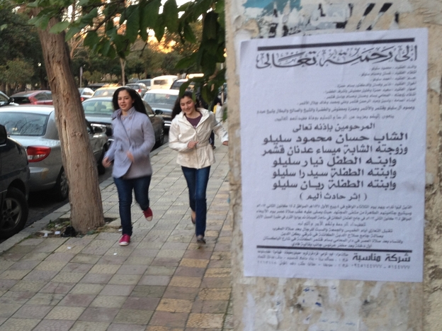 Death notices, like the one on the right, are becoming more common on the streets of Damascus.