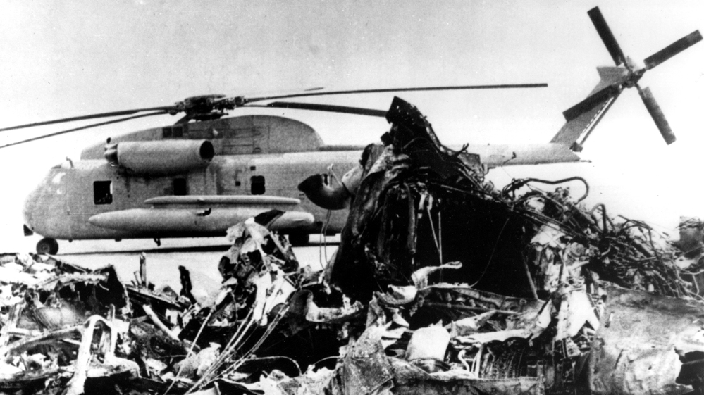 The remains of a burned-out U.S. helicopter and an abandoned chopper in the eastern desert of Iran on April 27, 1980, after the aborted American commando raid to free U.S. Embassy hostages.