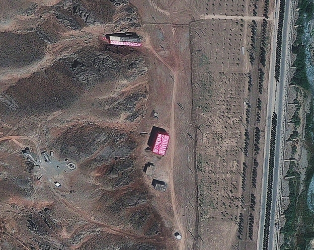 A photo from Aug. 15, 2012, supplied by the Institute for Science and International Security, shows buildings at the Parchin military base south of Tehran, Iran, shrouded in pink tarps. It's believed to be an effort to stop the U.N nuclear agency from monitoring the site, which is suspected of being used for secret work on atomic weapons.